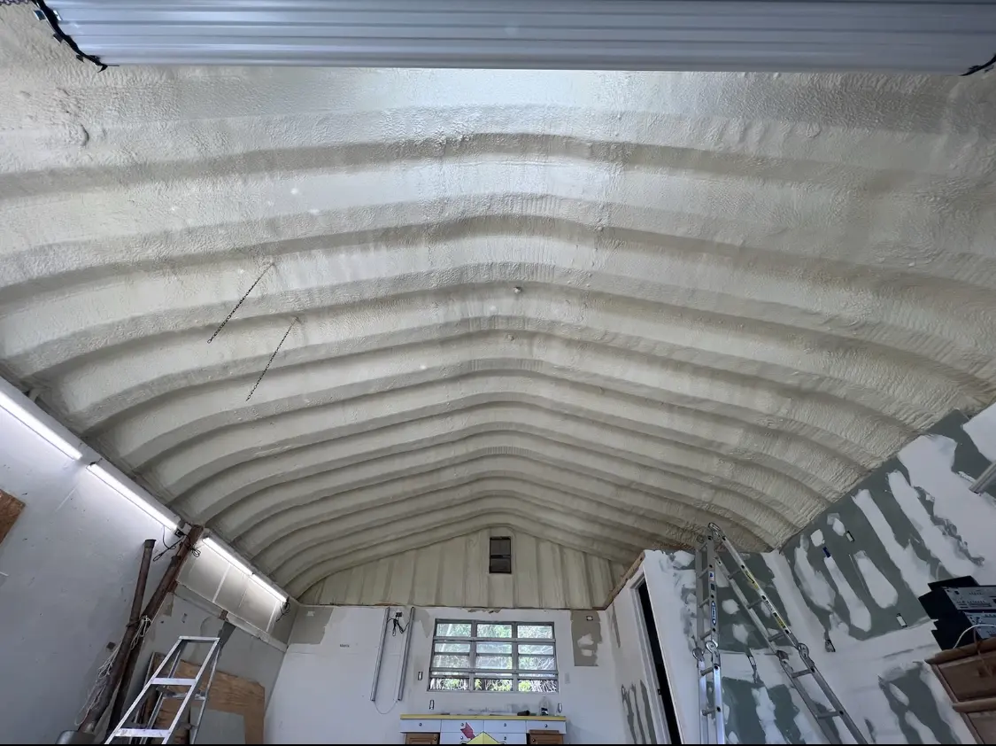 Spray polyurethane foam applied to the underside of a metal roof deck in Lunenburg
